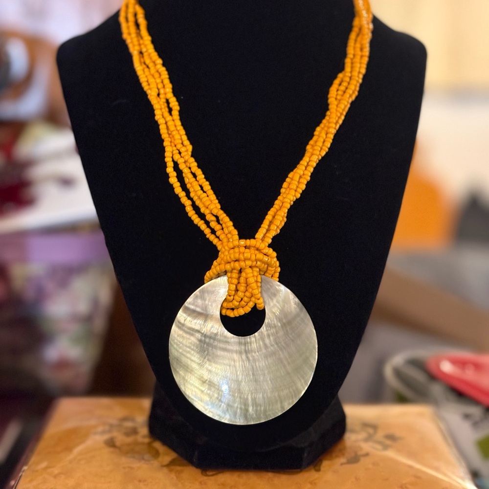 Natural shell and glass seed beads make for a sunny reminder of the beach!